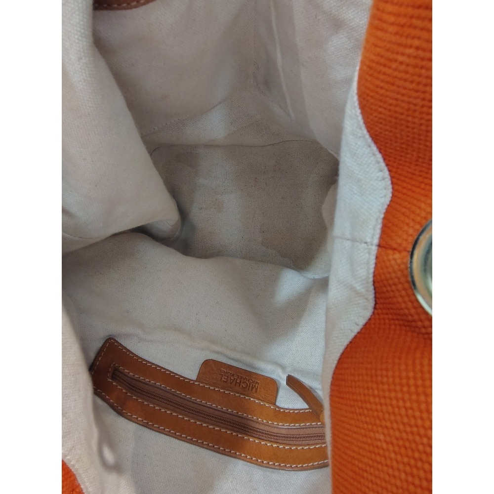 Michael Kors Marina hobo bag features an orange canvas body with braided rope... - Picture 8 of 11